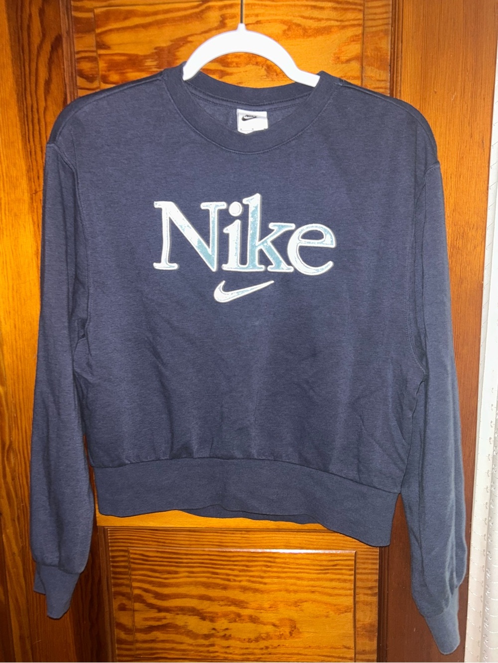 Nike Women's Navy Crewneck Sweatshirt with Light Blue Textured Logo